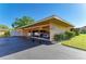 Carport with three cars and well kept hedges and shrubs at 2233 Beneva Ter # 2232, Sarasota, FL 34232
