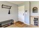 Well-organized entryway with coat rack, shoe storage, and decorative accents at 2233 Beneva Ter # 2232, Sarasota, FL 34232