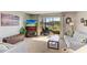 Cozy living room featuring a fireplace, comfortable seating, and scenic backyard views at 2233 Beneva Ter # 2232, Sarasota, FL 34232