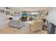 Bright living room with comfortable seating and sliding doors to outdoor patio at 2233 Beneva Ter # 2232, Sarasota, FL 34232