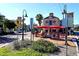 Charming outdoor cafe with red umbrellas and comfortable seating, ideal for relaxing and enjoying the ambiance at 2233 Beneva Ter # 2232, Sarasota, FL 34232