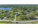 Beautiful home with lush landscaping, mature trees, long driveways, and surrounded by water at 22354 Panther Loop, Bradenton, FL 34202