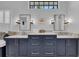 Bright bathroom featuring double sinks, granite counters, and modern lighting fixtures at 22354 Panther Loop, Bradenton, FL 34202