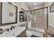 Bathroom features tiled walls, glass shower, and dark wood accents at 22354 Panther Loop, Bradenton, FL 34202
