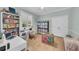 Bright bedroom features built-in shelving, desk and colorful decor at 22354 Panther Loop, Bradenton, FL 34202