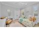 Cozy bedroom with hardwood floors, natural light, and neutral decor at 22354 Panther Loop, Bradenton, FL 34202