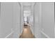 Hallway showing entryway to the bedroom with an arched entrance and two doors along the sides at 22354 Panther Loop, Bradenton, FL 34202