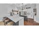 Gourmet kitchen with granite countertops, modern appliances, custom island and breakfast bar seating at 22354 Panther Loop, Bradenton, FL 34202
