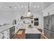 Well-equipped kitchen featuring stainless steel appliances, custom cabinets, and granite countertops at 22354 Panther Loop, Bradenton, FL 34202