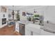 Bright, modern kitchen featuring granite countertops, stainless steel appliances, and a farmhouse sink at 22354 Panther Loop, Bradenton, FL 34202