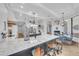 Open layout kitchen with granite countertops, breakfast bar seating and views to fireplace at 22354 Panther Loop, Bradenton, FL 34202