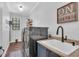 The laundry room features stainless steel appliances and rustic decor at 22354 Panther Loop, Bradenton, FL 34202