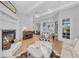 Inviting living room showcasing a fireplace, wood floors, stylish furniture, and an open floor plan at 22354 Panther Loop, Bradenton, FL 34202