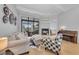 Bright living room featuring wood floors, neutral decor, stylish seating, and fireplace at 22354 Panther Loop, Bradenton, FL 34202
