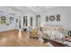 Bright living room featuring wood floors, neutral decor, stylish seating, and high ceilings at 22354 Panther Loop, Bradenton, FL 34202