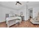 Well-lit main bedroom features brick floors and calm, neutral colors at 22354 Panther Loop, Bradenton, FL 34202