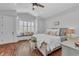 Inviting main bedroom with brick floors, bay window and a cozy seating area at 22354 Panther Loop, Bradenton, FL 34202