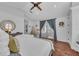 Calming main bedroom with brick floors, stylish furniture and soft accents at 22354 Panther Loop, Bradenton, FL 34202