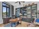 Spacious office with hardwood floors, dark built-ins, and a large window for natural light at 22354 Panther Loop, Bradenton, FL 34202
