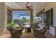 A screened-in patio features brick floors, seating and a view of the pool at 22354 Panther Loop, Bradenton, FL 34202