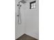 Shower with white subway tile and a black rain shower head at 22354 Panther Loop, Bradenton, FL 34202