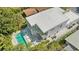High angle aerial view of the modern home highlighting pool, yard and outdoor dining area at 2327 Hillview St, Sarasota, FL 34239