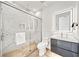 Modern bathroom featuring an illuminated mirror and a glass-enclosed shower at 2327 Hillview St, Sarasota, FL 34239