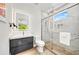 Modern bathroom features a glass-enclosed shower and sleek vanity with a lighted mirror at 2327 Hillview St, Sarasota, FL 34239