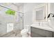 Sleek bathroom with glass shower, marble tiles, and contemporary vanity at 2327 Hillview St, Sarasota, FL 34239