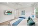 Stylish bedroom with modern decor, featuring a wall-mounted TV with pool view at 2327 Hillview St, Sarasota, FL 34239