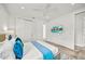 Modern bedroom with a wall-mounted TV displaying a pool view and soft decor at 2327 Hillview St, Sarasota, FL 34239
