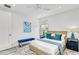 Cozy bedroom with a ceiling fan, stylish decor, and a bright window at 2327 Hillview St, Sarasota, FL 34239