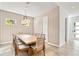 Bright dining room with a rustic wooden table and patterned wallpaper at 2327 Hillview St, Sarasota, FL 34239