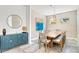 Elegant dining room featuring a large wooden table, stylish chairs, and designer wallpaper at 2327 Hillview St, Sarasota, FL 34239
