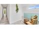 Bright hallway with modern decor, leading to a view of the exterior landscape at 2327 Hillview St, Sarasota, FL 34239