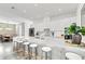 Elegant kitchen with long island, white countertops, barstool seating, and stainless steel appliances at 2327 Hillview St, Sarasota, FL 34239