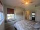 Bedroom featuring a window seat, neutral color palette, ceiling fan, and natural lighting at 2334 Felicity Pl, North Port, FL 34289