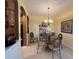 Elegant dining area featuring stylish furnishings, decorative lighting, and open access at 2334 Felicity Pl, North Port, FL 34289