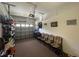 A spacious garage with an automatic door and shelving, providing ample storage space at 2334 Felicity Pl, North Port, FL 34289