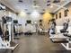 Spacious gym featuring exercise equipment such as a treadmill, elliptical, stationary bike and weight machines at 2334 Felicity Pl, North Port, FL 34289