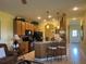 Well-lit kitchen with granite countertops, modern appliances, and a breakfast bar at 2334 Felicity Pl, North Port, FL 34289