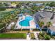Aerial view of community pool, hot tub, playground, and clubhouse at 2334 Felicity Pl, North Port, FL 34289