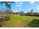 Expansive backyard features green grass and privacy fence at 2361 Rose St, Sarasota, FL 34239