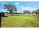 Spacious backyard featuring green grass and privacy fence at 2361 Rose St, Sarasota, FL 34239