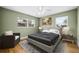 Cozy bedroom featuring natural light, ceiling fan and stylish decor at 2361 Rose St, Sarasota, FL 34239