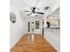 Bright dining area with hardwood flooring, an open-concept layout, and a ceiling fan at 2361 Rose St, Sarasota, FL 34239