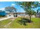 Charming single-story home with fresh exterior paint and a well-maintained lawn, presenting great curb appeal at 2361 Rose St, Sarasota, FL 34239