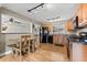 Eat-in kitchen with modern appliances, black hardware, wood cabinets, and a cozy dining nook at 2361 Rose St, Sarasota, FL 34239