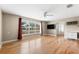 Bright living room with hardwood flooring, opening into the dining and kitchen area at 2361 Rose St, Sarasota, FL 34239