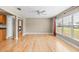 Bright living room with hardwood flooring, opening into the dining and kitchen area at 2361 Rose St, Sarasota, FL 34239